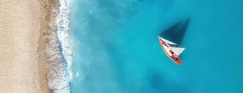 Traditional gulet anchored in calm turquoise bay
